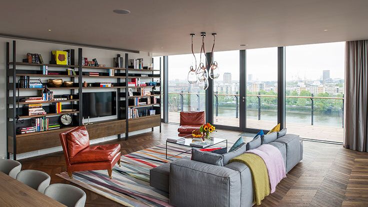 Image may contain: Home Decor, Lamp, Indoors, Interior Design, Chair, Furniture, Table, Architecture, and Building