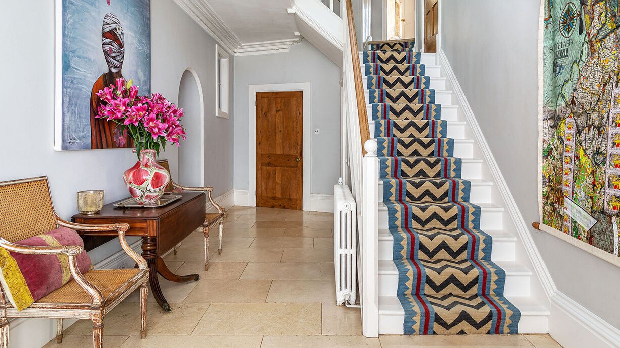 Image may contain: Desk, Furniture, Table, Chair, Architecture, Building, Foyer, Indoors, House, Housing, and Staircase