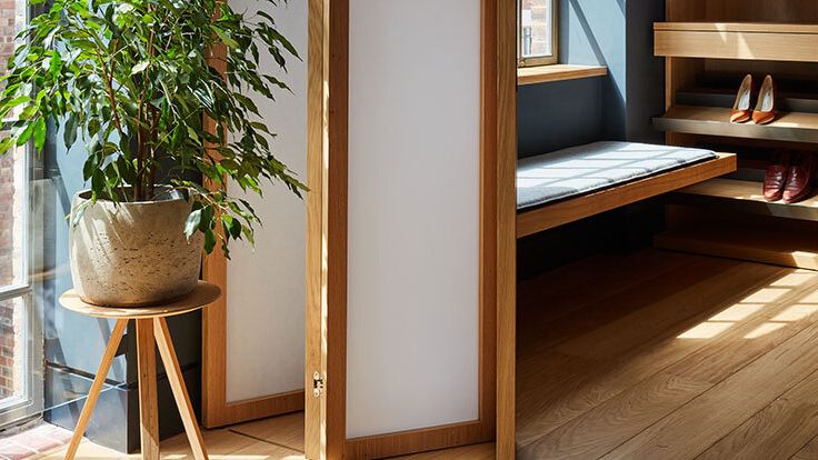 Image may contain: Indoors, Interior Design, Wood, Floor, Plant, Clothing, Footwear, High Heel, Shoe, Hardwood, and Flooring