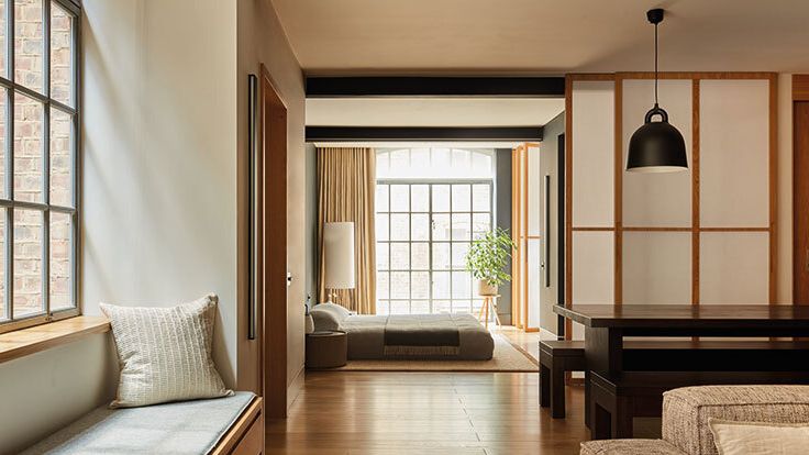 Image may contain: Plant, Lamp, Indoors, Interior Design, Couch, Furniture, Architecture, Building, Living Room, and Room