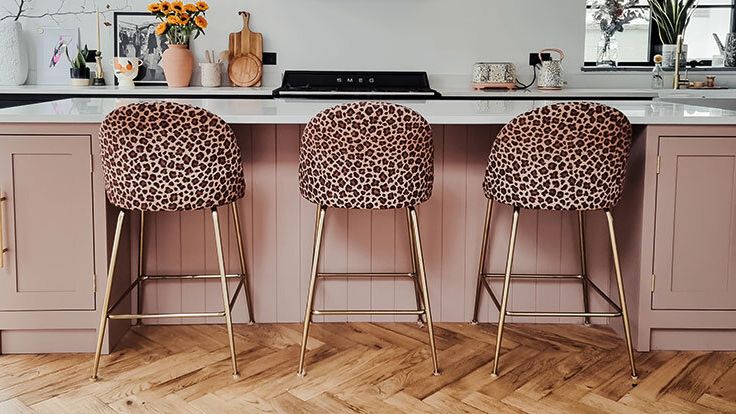 Image may contain: Indoors, Interior Design, Floor, Wood, Chair, Furniture, Hardwood, Plant, Kitchen, Cup, Flooring, and Art