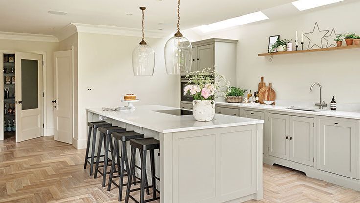 Image may contain: Indoors, Interior Design, Kitchen, Kitchen Island, Architecture, Building, Dining Room, and Dining Table