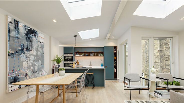 Image may contain: Architecture, Building, Dining Room, Dining Table, Furniture, Indoors, Room, Table, Plant, and Chair