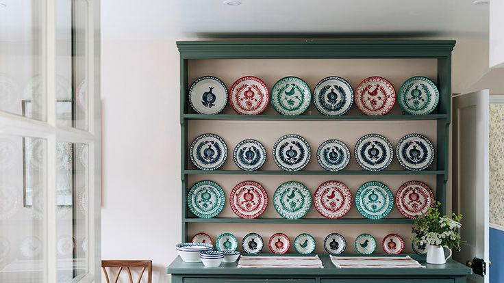 Image may contain: Chair, Furniture, Plate, Closet, Cupboard, Plate Rack, Hockey, Ice Hockey, Ice Hockey Puck, and Rink