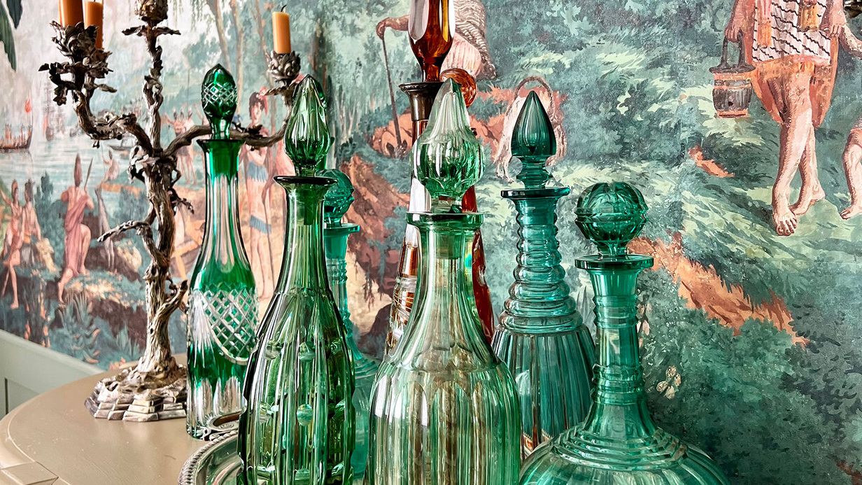 Image may contain: Adult, Person, Candle, and Bottle