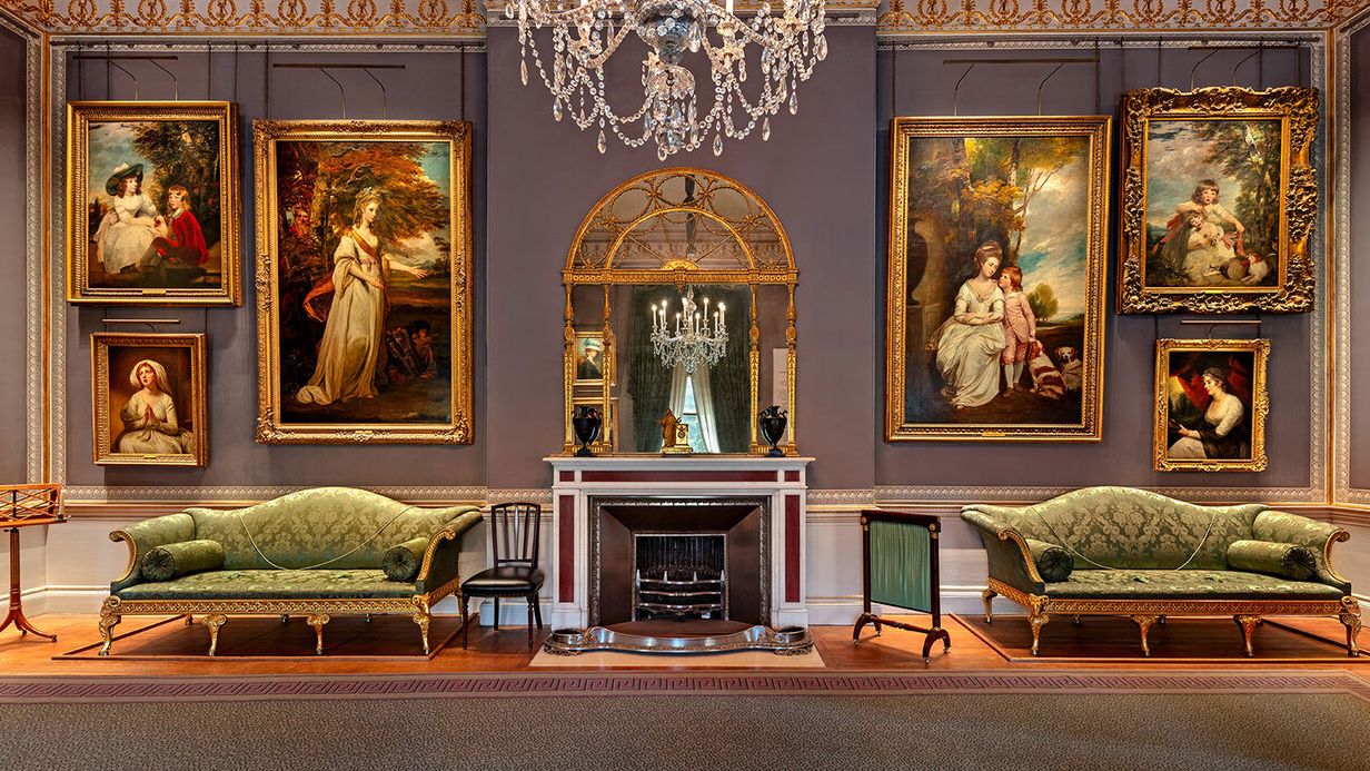 Image may contain: Lamp, Art, Painting, Chair, Furniture, Indoors, Person, Couch, Home Decor, Clothing, and Hat