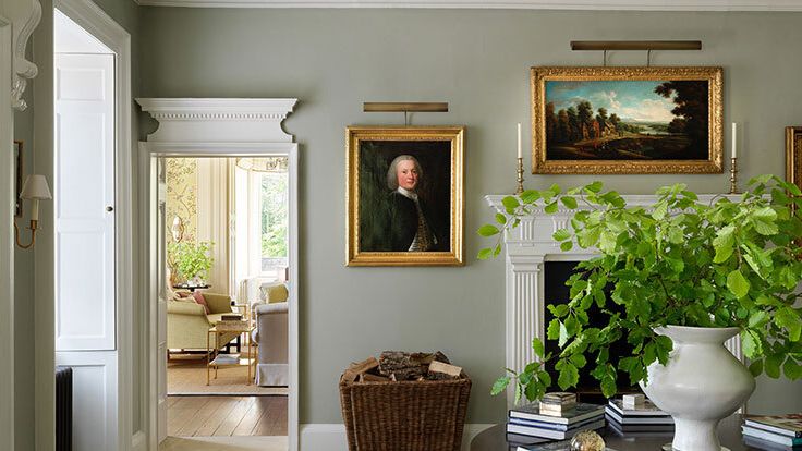 Image may contain: Matthias Claudius, Plant, Potted Plant, Art, Painting, Lamp, Book, Publication, Corner, Person, and Couch