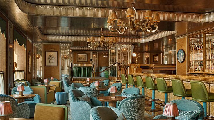 Image may contain: Lamp, Dining Table, Furniture, Table, Architecture, Building, Dining Room, Indoors, Room, and Art