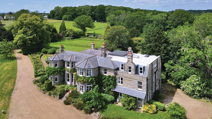 Image may contain: Architecture, Building, Housing, Outdoors, House, Aerial View, Driveway, and Manor