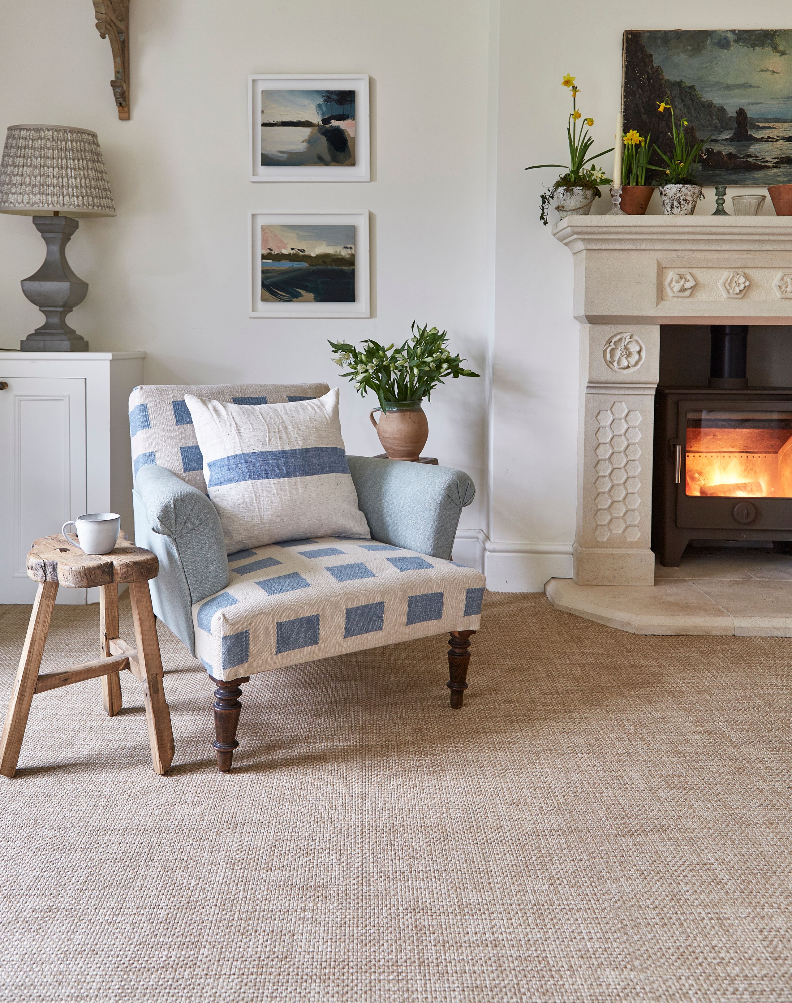 Image may contain: Home Decor, Plant, Fireplace, Indoors, Furniture, Cup, Art, Painting, Cushion, Couch, and Chair