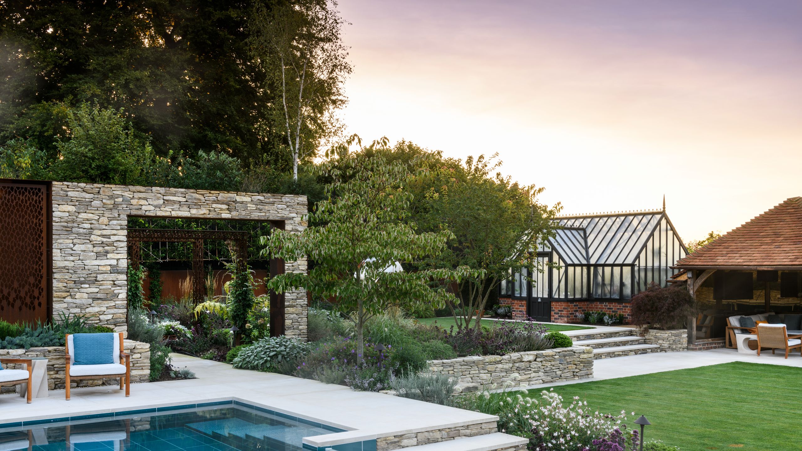 Image may contain: Backyard, Nature, Outdoors, Yard, Architecture, Building, House, Housing, Villa, Chair, and Furniture