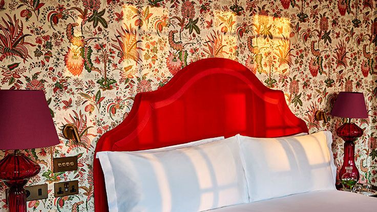 Image may contain: Lamp, Cushion, Home Decor, Table Lamp, Bed, Furniture, Indoors, Interior Design, Accessories, and Bag