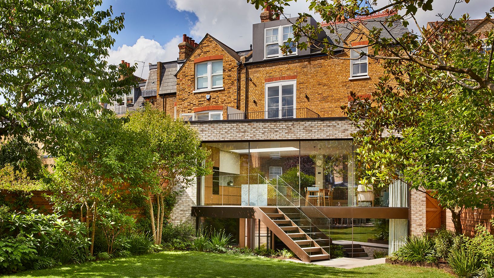 Image may contain: Grass, Plant, Architecture, Building, Housing, City, House, and Lawn