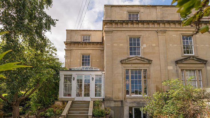 Image may contain: Architecture, Building, Housing, House, Portico, Manor, Animal, and Bird