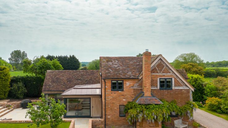 Image may contain: Bench, Furniture, Architecture, Building, Cottage, House, Housing, and Outdoors