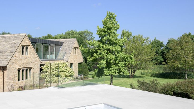 Image may contain: Architecture, Building, House, Housing, Villa, Grass, Plant, Pool, Water, Backyard, Nature, and Outdoors