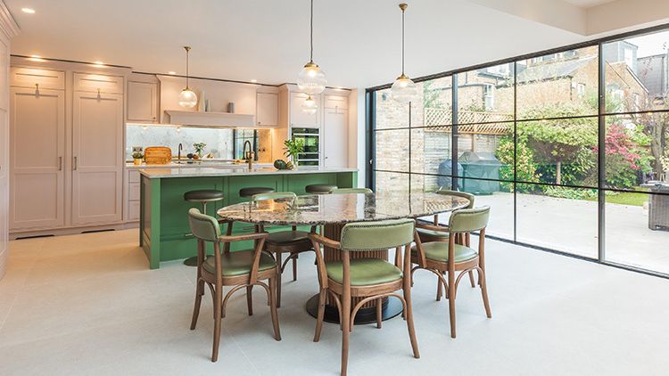 Image may contain: Architecture, Building, Dining Room, Dining Table, Furniture, Indoors, Room, Table, Lamp, and Chair