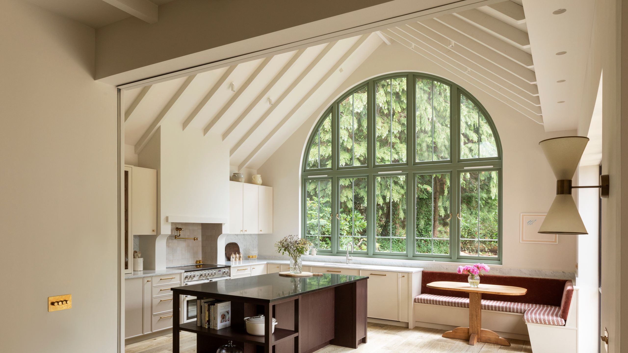 Image may contain: Indoors, Interior Design, Kitchen, Plant, Desk, Furniture, Table, Architecture, Building, and Housing