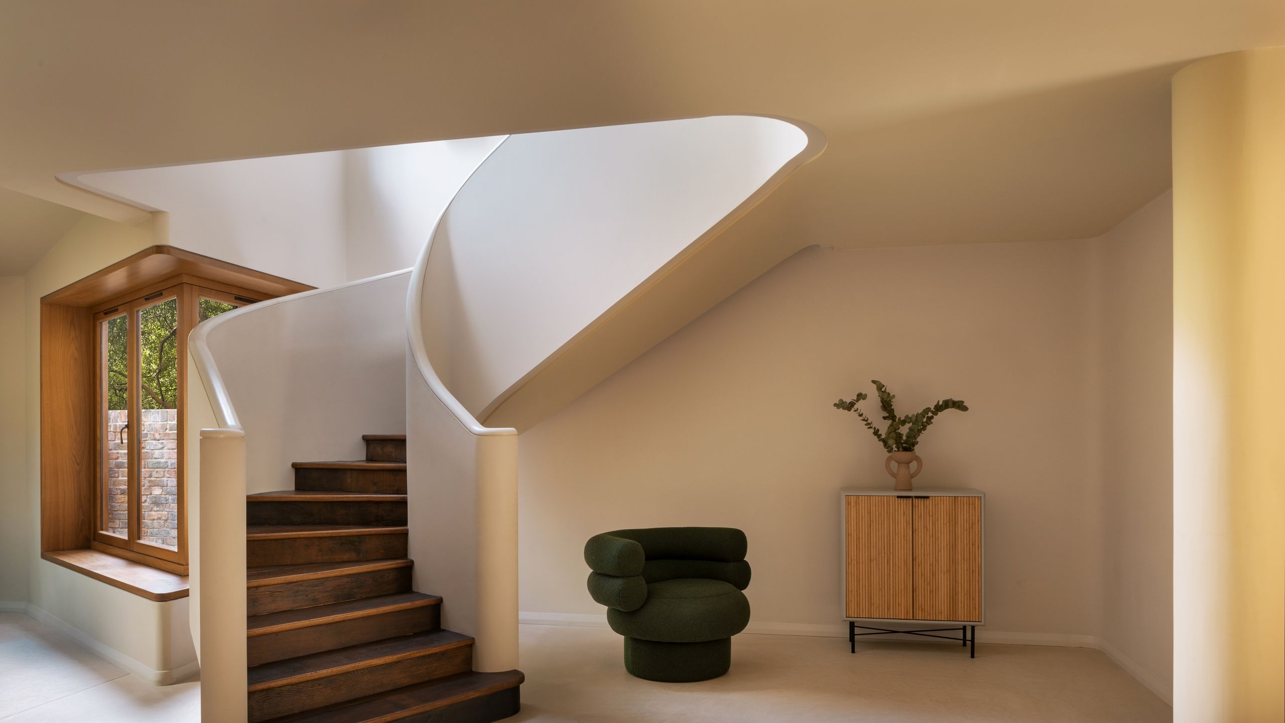 Image may contain: Architecture, Building, House, Housing, Staircase, Corner, Plant, Indoors, Interior Design, and Chair