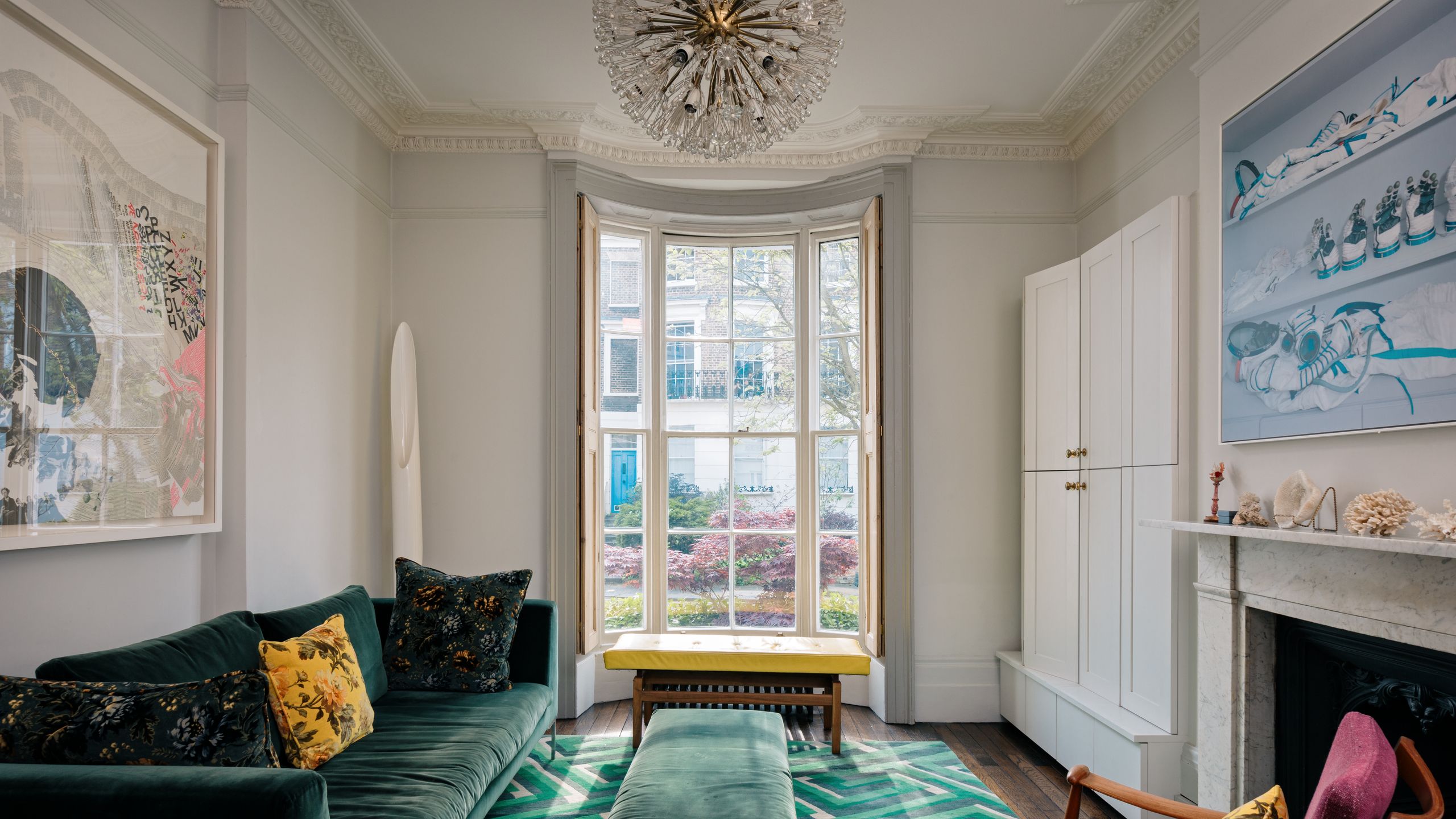 Image may contain: Couch, Furniture, Chair, Window, Home Decor, Art, Painting, Bench, Bay Window, Lamp, and Architecture