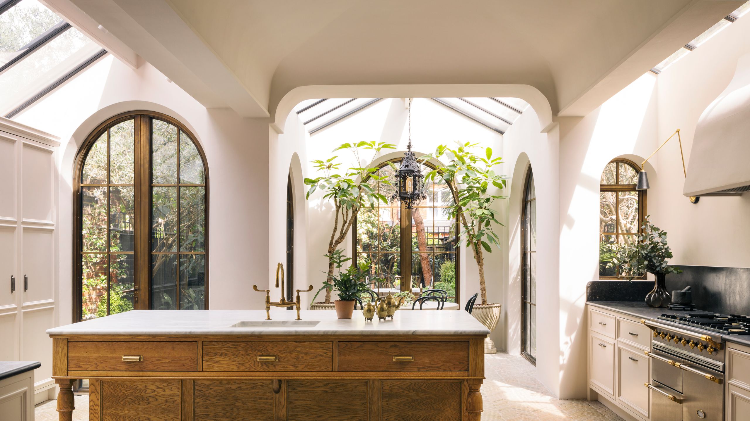 Image may contain: Sink, Plant, Sink Faucet, Indoors, Interior Design, Lamp, Chair, and Furniture