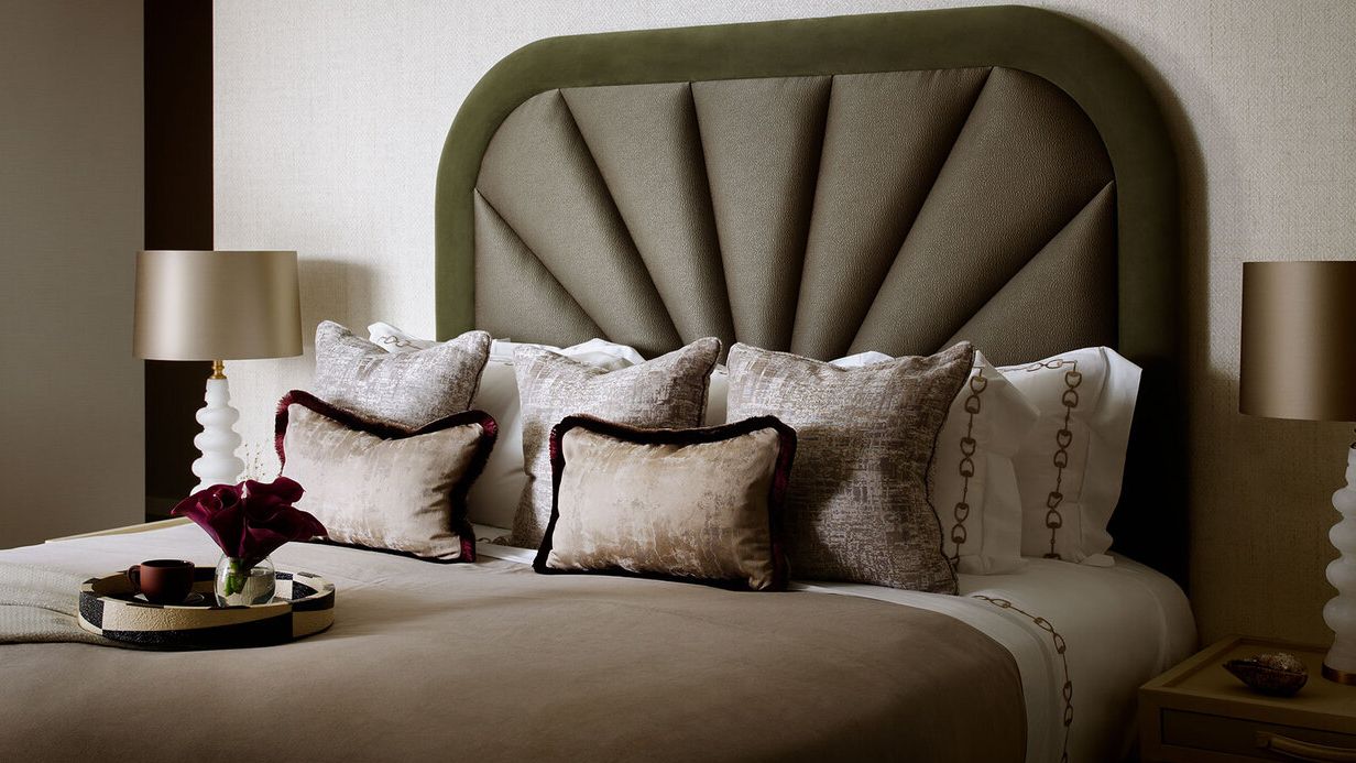 Image may contain: Cushion, Home Decor, Lamp, Pillow, Bed, Furniture, Table Lamp, Cup, Couch, Linen, and Indoors