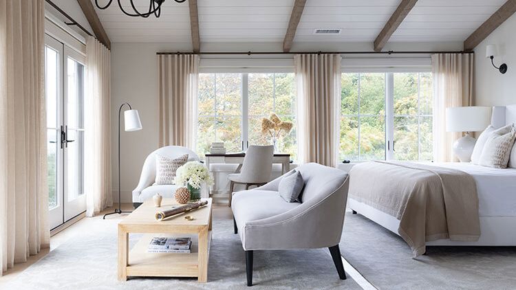 Image may contain: Home Decor, Indoors, Interior Design, Chair, Furniture, Lamp, Bed, Book, Publication, Window, and Rug