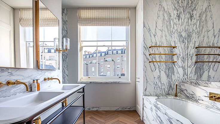 Image may contain: Bathing, Bathtub, Person, Tub, Sink, Sink Faucet, Indoors, and Interior Design