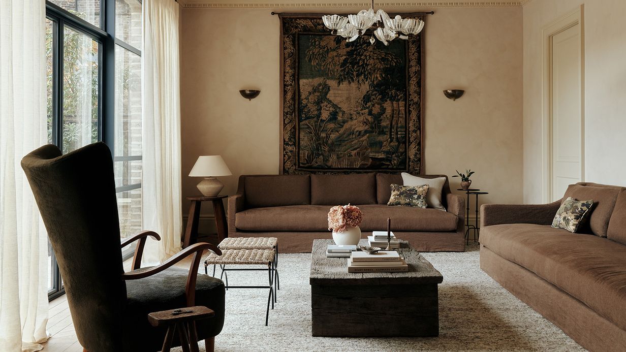 Image may contain: Home Decor, Chair, Furniture, Lamp, Architecture, Building, Indoors, Living Room, Room, and Table