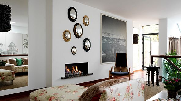 Image may contain: Fireplace, Indoors, Architecture, Building, Furniture, Living Room, Room, Home Decor, Chair, and Couch