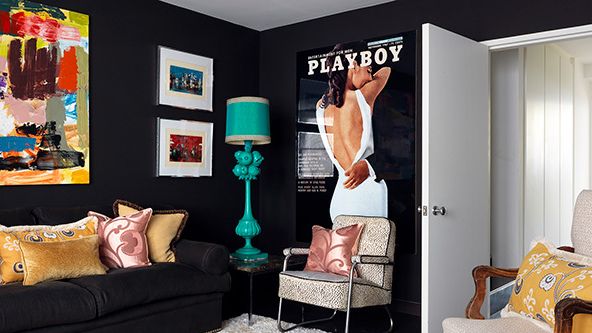 Image may contain: Lamp, Home Decor, Chair, Furniture, Couch, Adult, Person, Cushion, Art, Painting, and Table Lamp