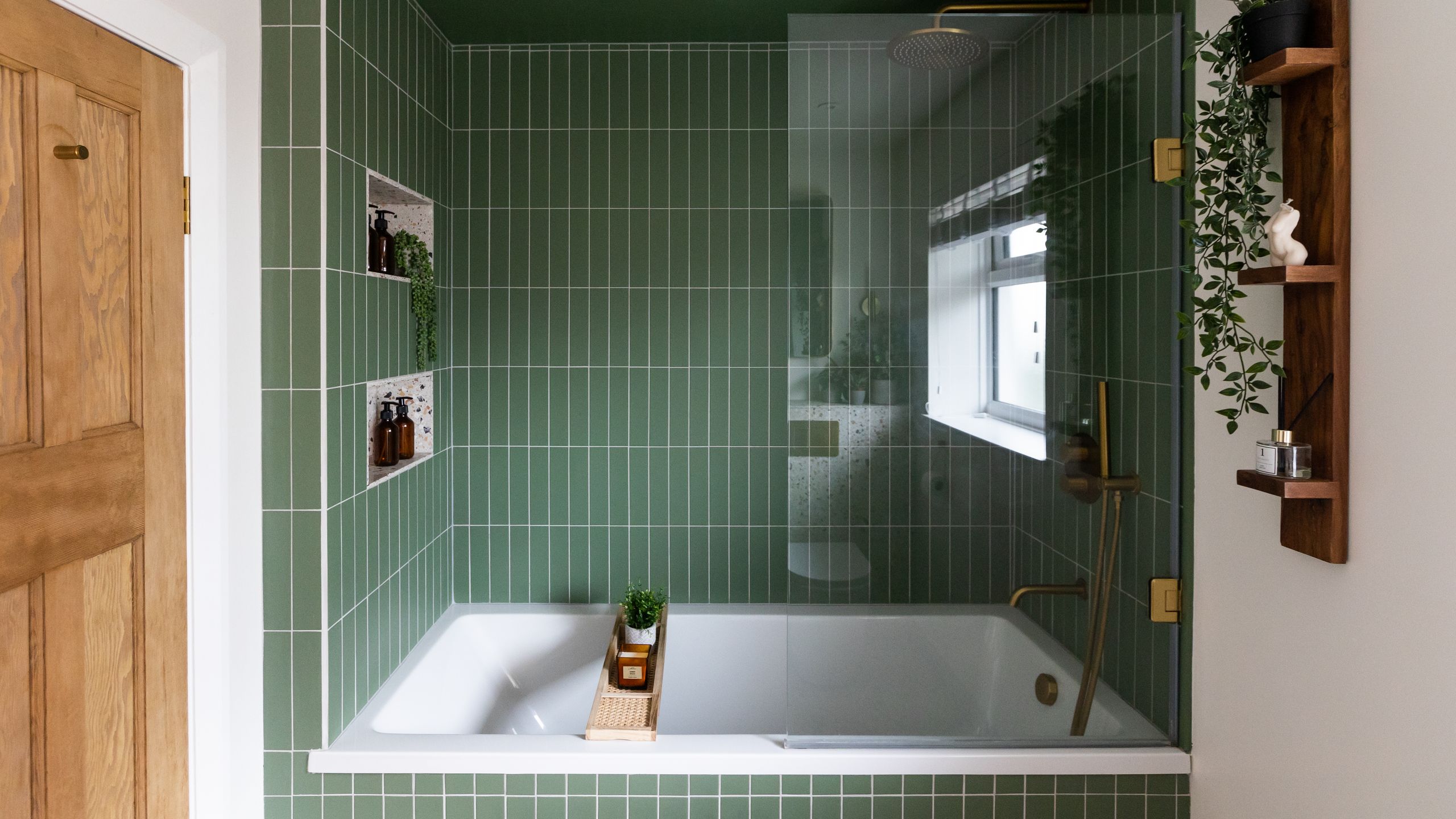 Image may contain: Bathing, Indoors, Tub, Interior Design, Plant, Bathtub, Person, Cup, Bathroom, and Room