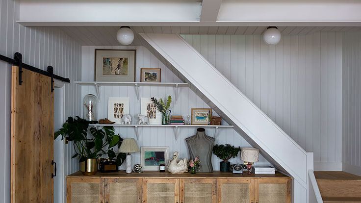 Image may contain: Indoors, Interior Design, Lamp, Plant, Art, Painting, Architecture, Building, House, and Housing