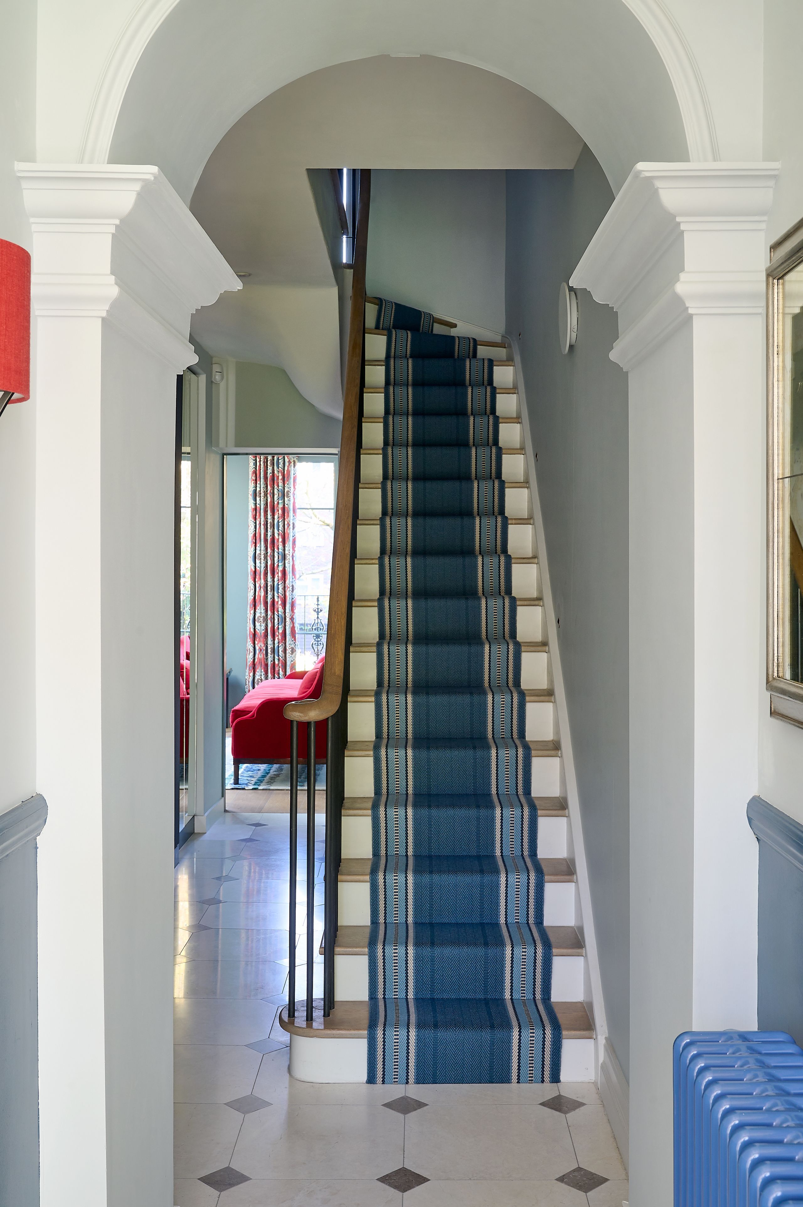 Image may contain: Architecture, Building, House, Housing, Staircase, Foyer, Indoors, Chair, and Furniture