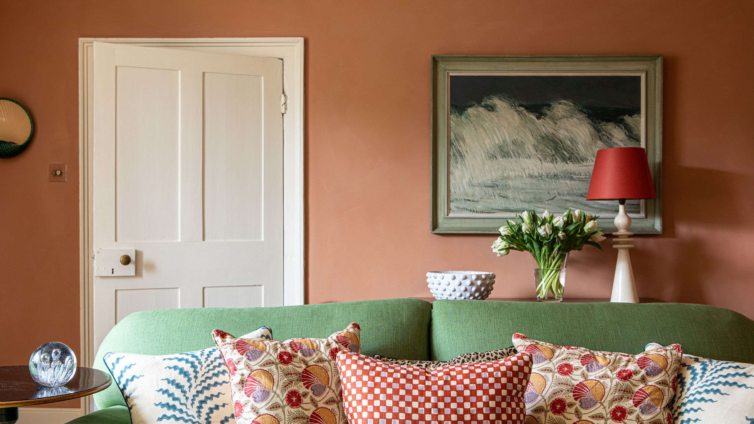 Image may contain: Cushion, Home Decor, Couch, Furniture, Lamp, Pillow, Art, Painting, Architecture, Building, and Indoors