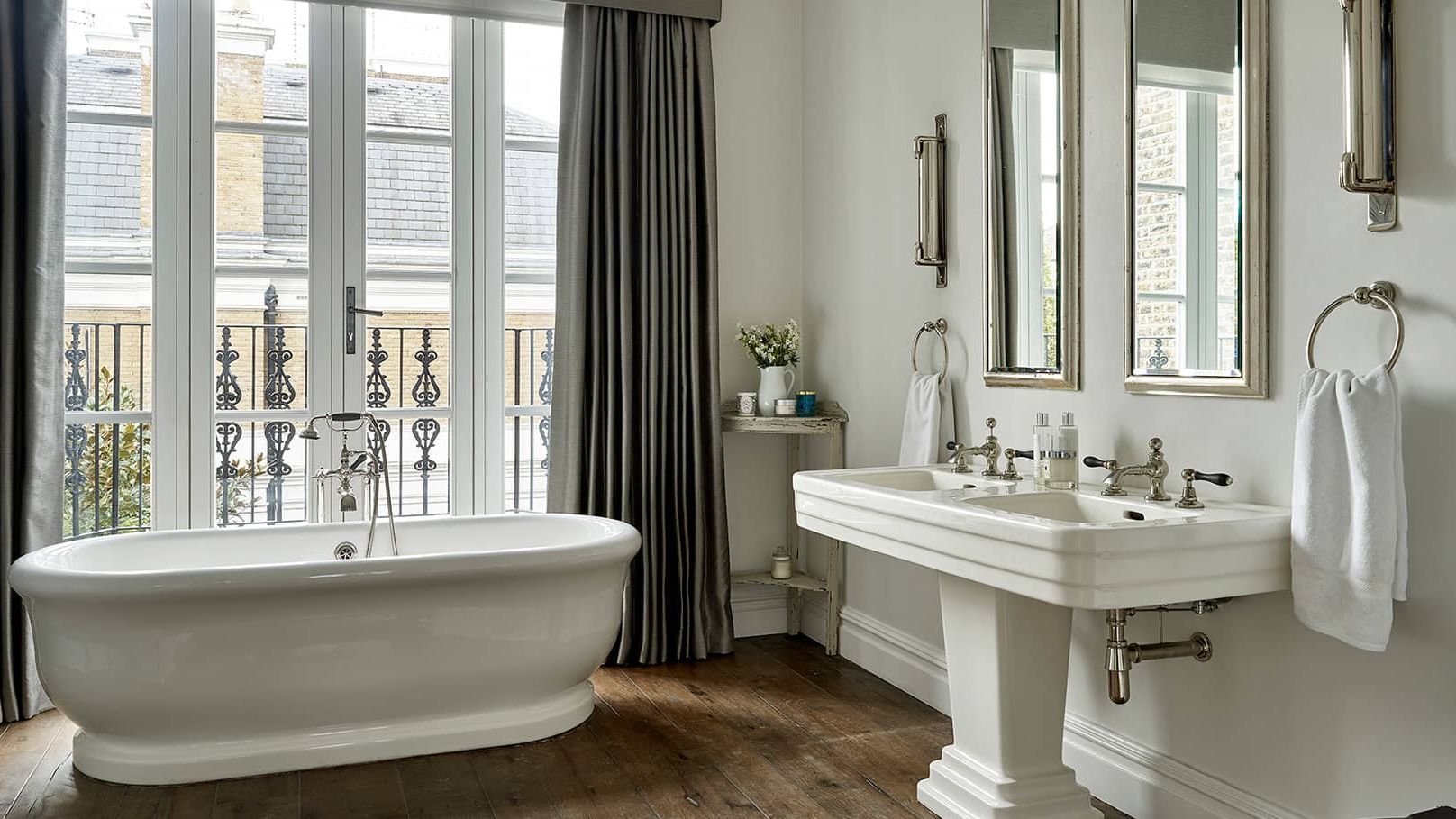 Image may contain: Bathing, Bathtub, Person, Tub, Cup, Sink, Sink Faucet, and Indoors