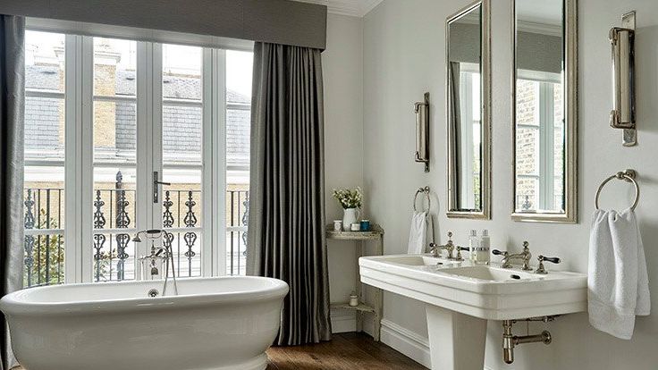 Image may contain: Bathing, Bathtub, Person, Tub, Plant, Sink, Sink Faucet, Cup, and Indoors