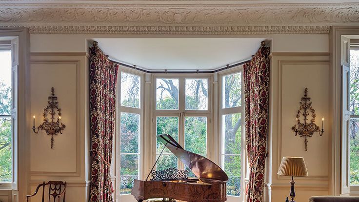 Image may contain: Chair, Furniture, Keyboard, Musical Instrument, Piano, Window, Lamp, Bay Window, French Window, and Couch