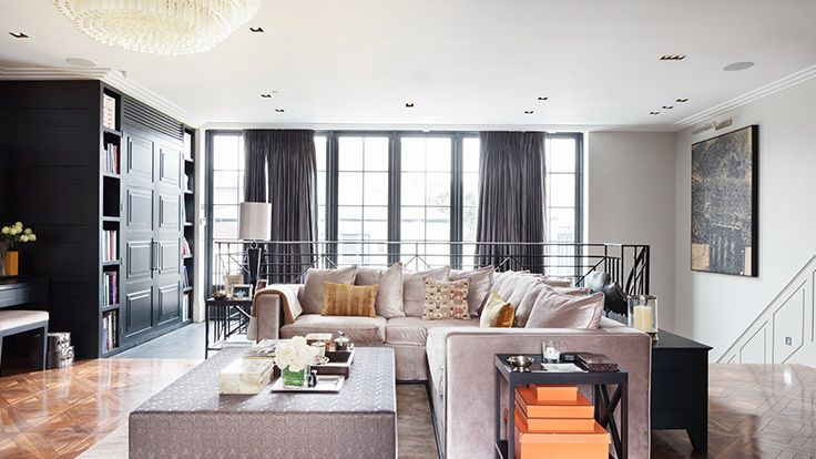 Image may contain: Home Decor, Lamp, Architecture, Building, Furniture, Indoors, Living Room, Room, Table, and Couch