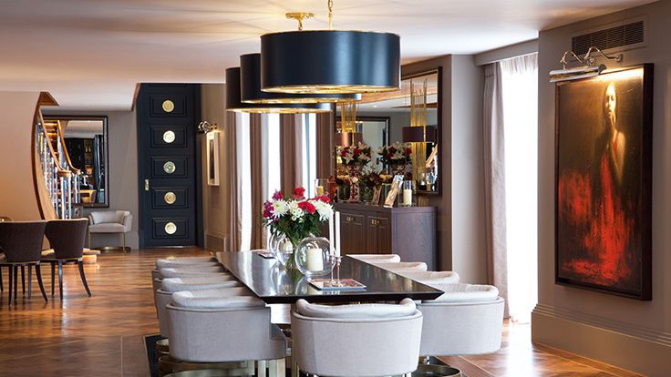 Image may contain: Architecture, Building, Dining Room, Dining Table, Furniture, Indoors, Room, Table, and Lamp