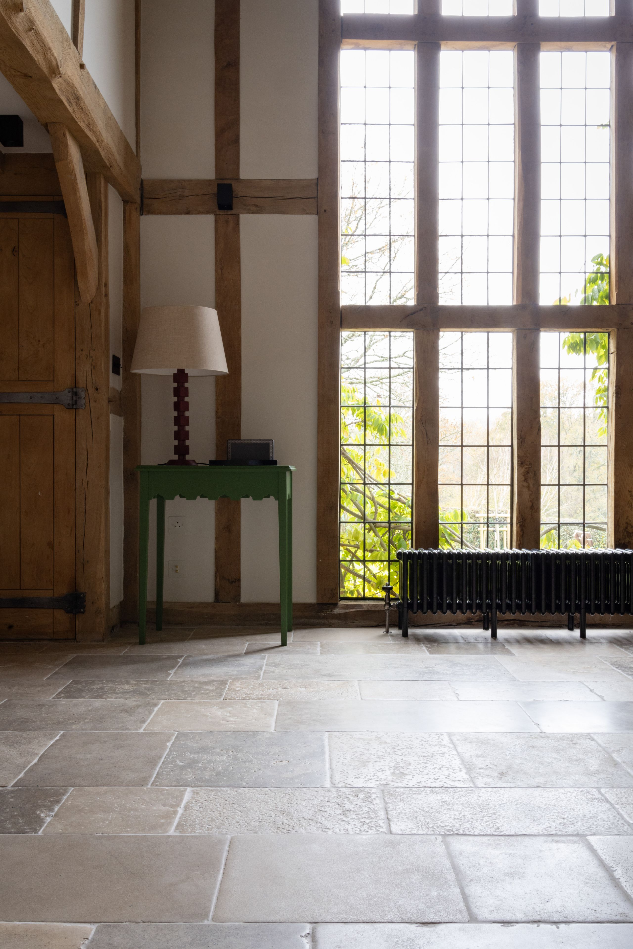 Image may contain: Floor, Flooring, Lamp, Indoors, Interior Design, Desk, Furniture, Table, and Bench