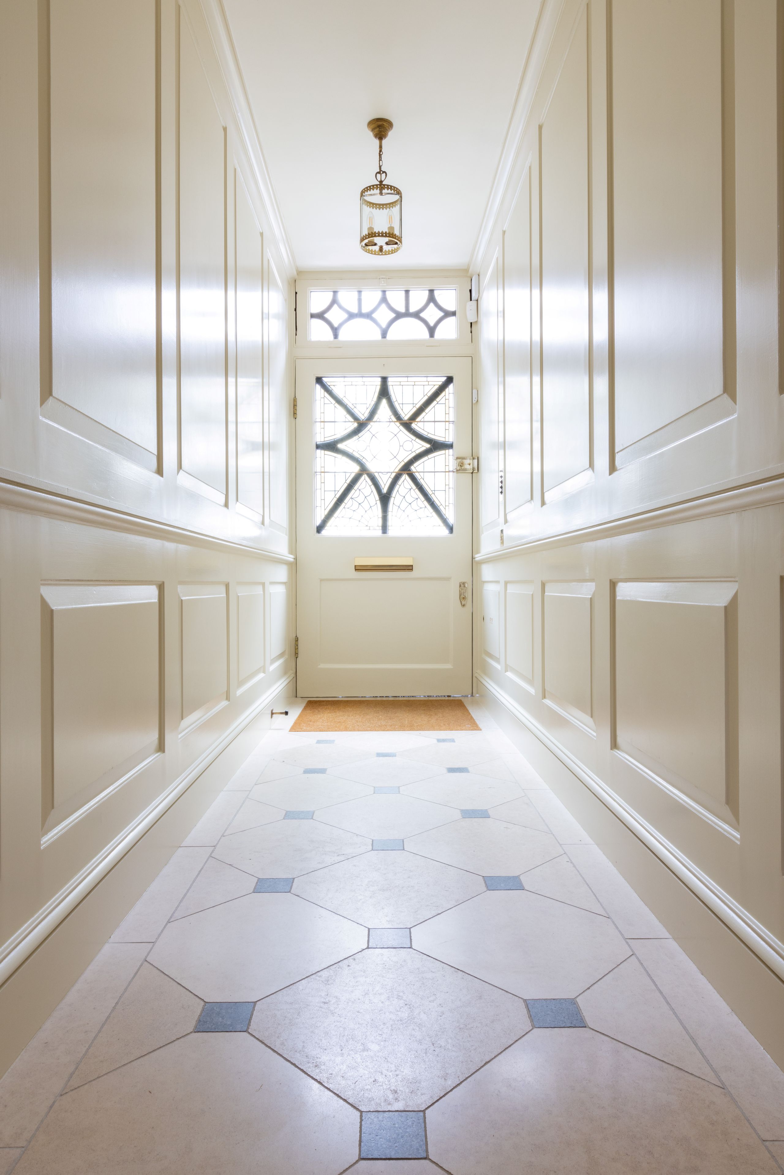 Image may contain: Floor, Lamp, Flooring, Indoors, Home Decor, Rug, Architecture, Building, Corridor, and Hallway