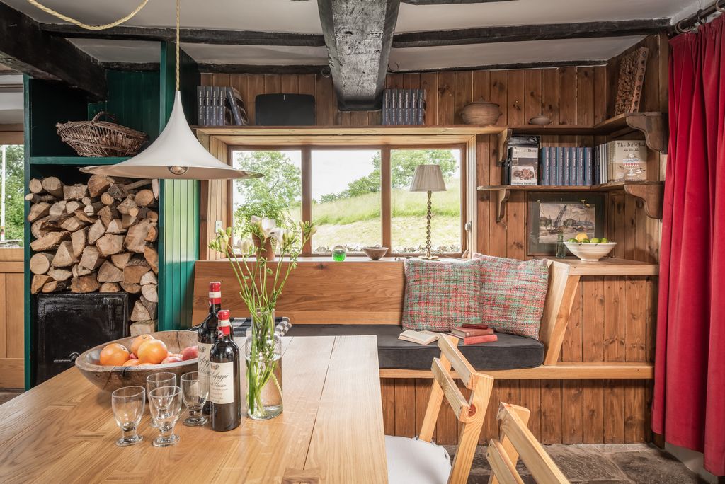 Image may contain Indoors Interior Design Wood Lamp Hardwood Stained Wood Architecture Building and Furniture