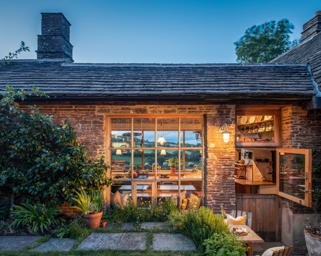 Image may contain Indoors Interior Design Architecture Building Cottage House Housing Lamp Plant Wood and Hotel