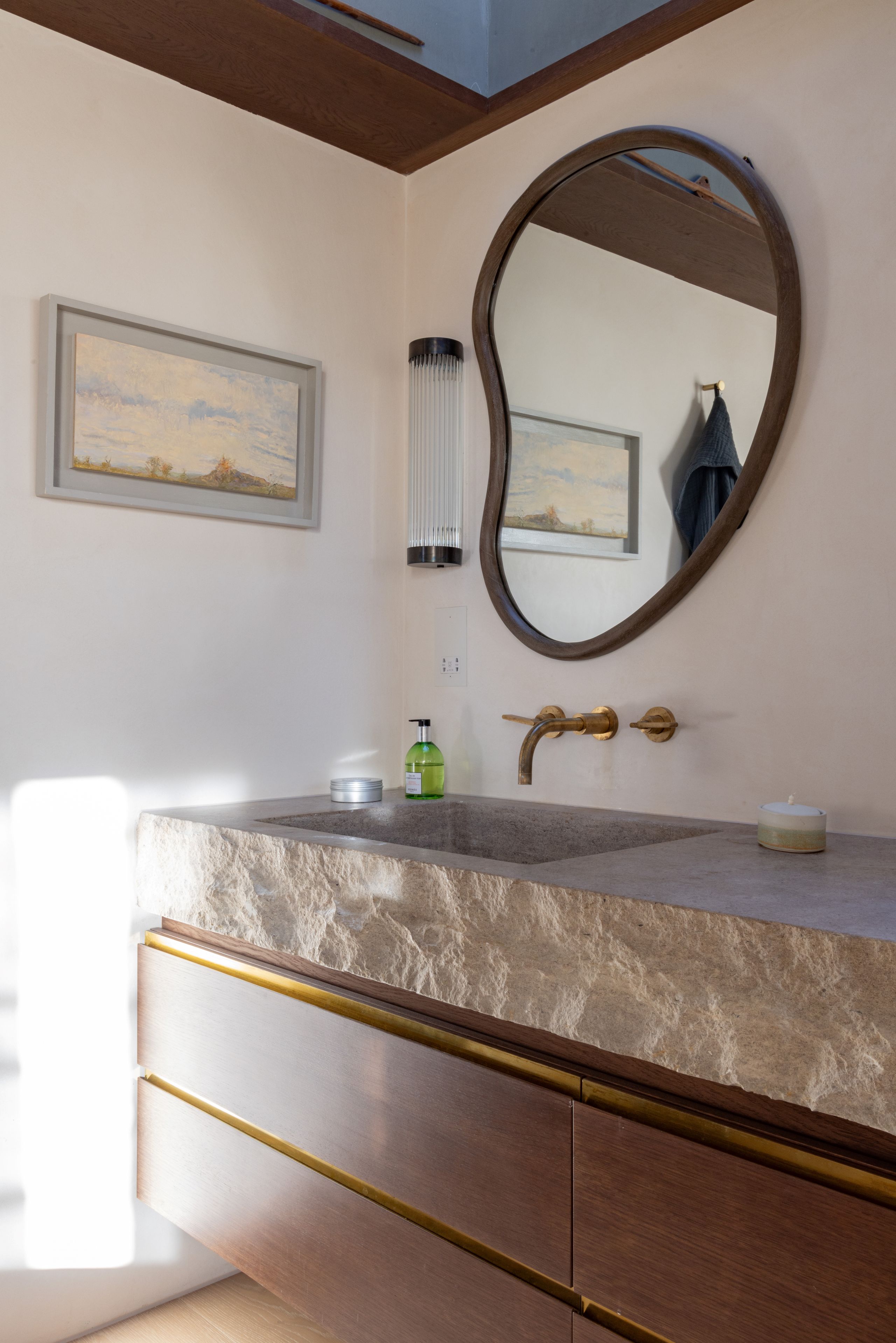 Image may contain: Sink, Sink Faucet, Indoors, Interior Design, Art, Painting, Candle, and Lamp