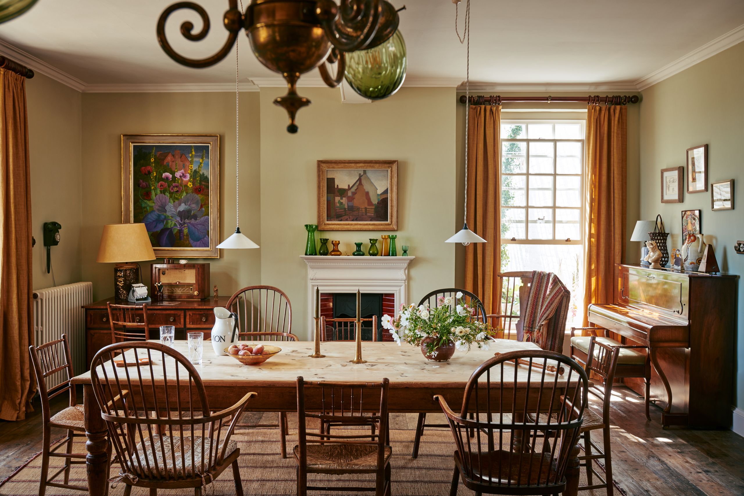 Image may contain: Architecture, Building, Dining Room, Dining Table, Furniture, Indoors, Room, Table, Lamp, and Home Decor