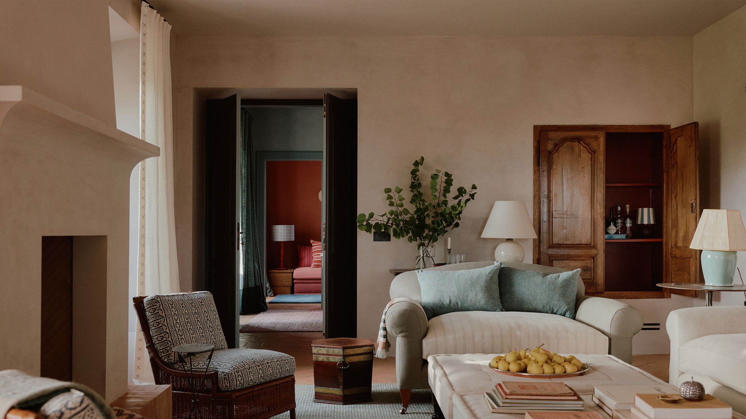 Image may contain: Lamp, Home Decor, Chair, Furniture, Architecture, Building, Indoors, Living Room, Room, Couch, and Table