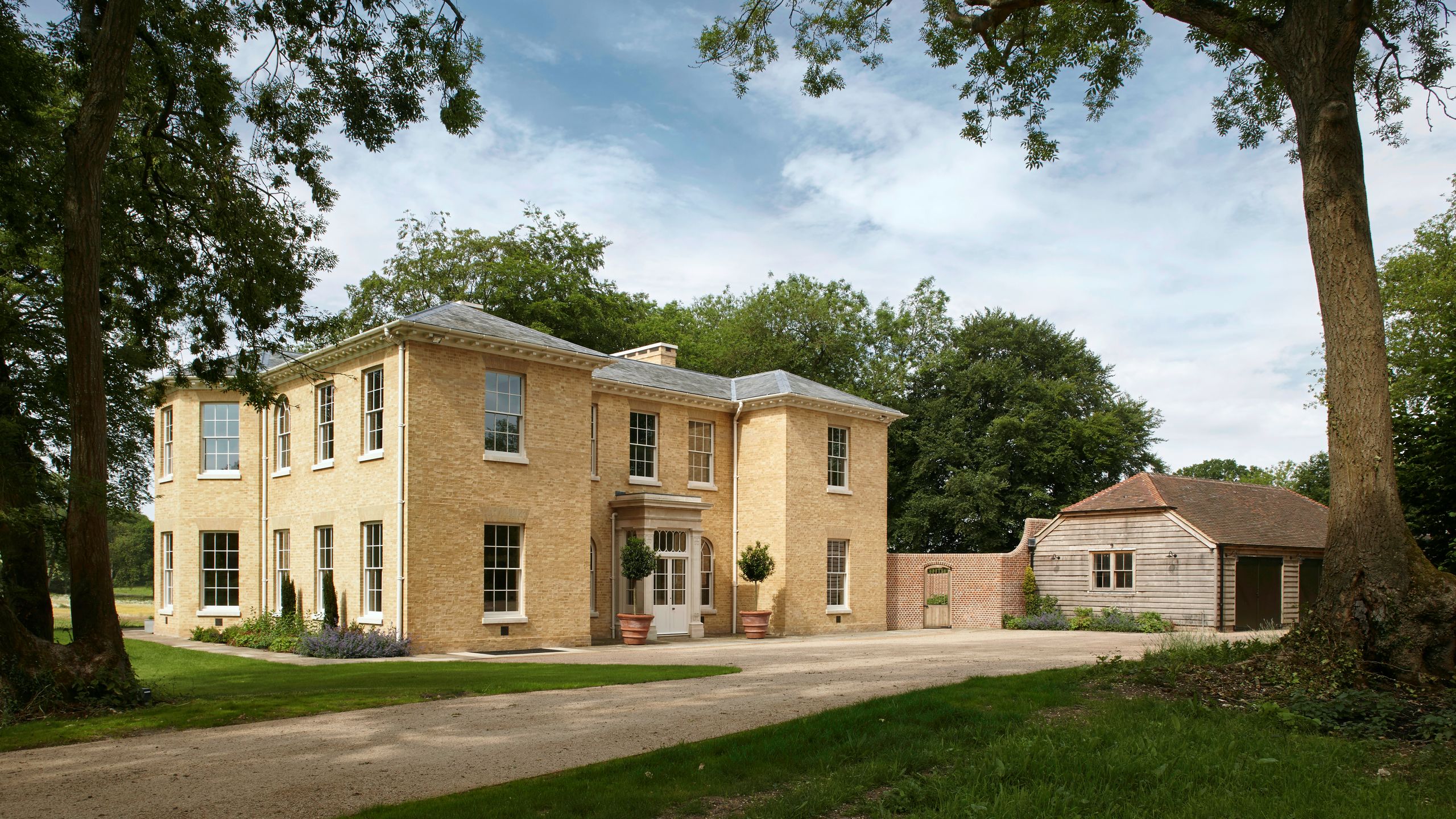 Image may contain: Plant, Grass, Architecture, Building, Housing, House, Outdoors, Vegetation, Villa, Manor, and Oak