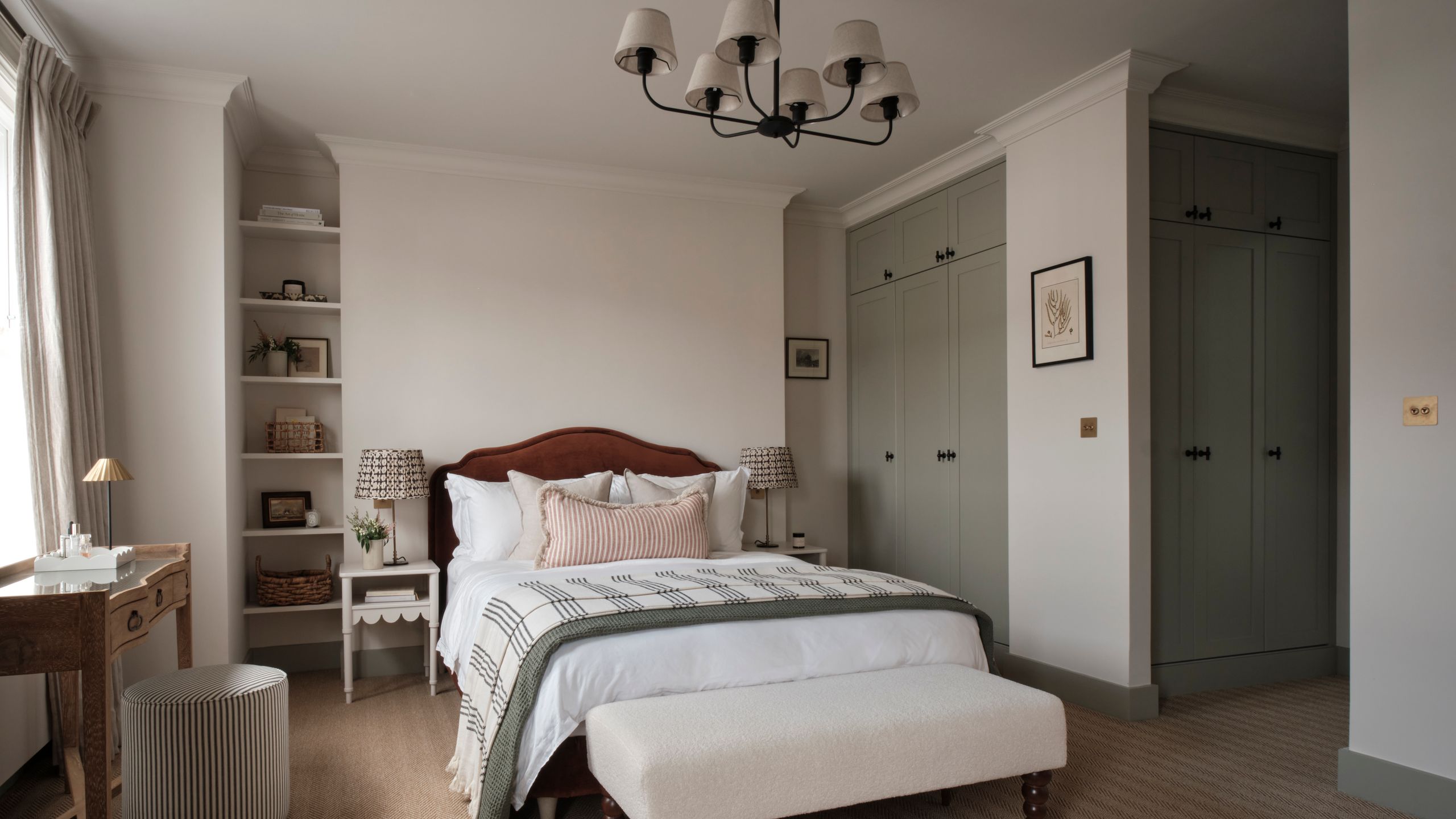 Image may contain: Corner, Home Decor, Lamp, Desk, Furniture, Table, Indoors, Interior Design, Bed, Bench, and Chandelier