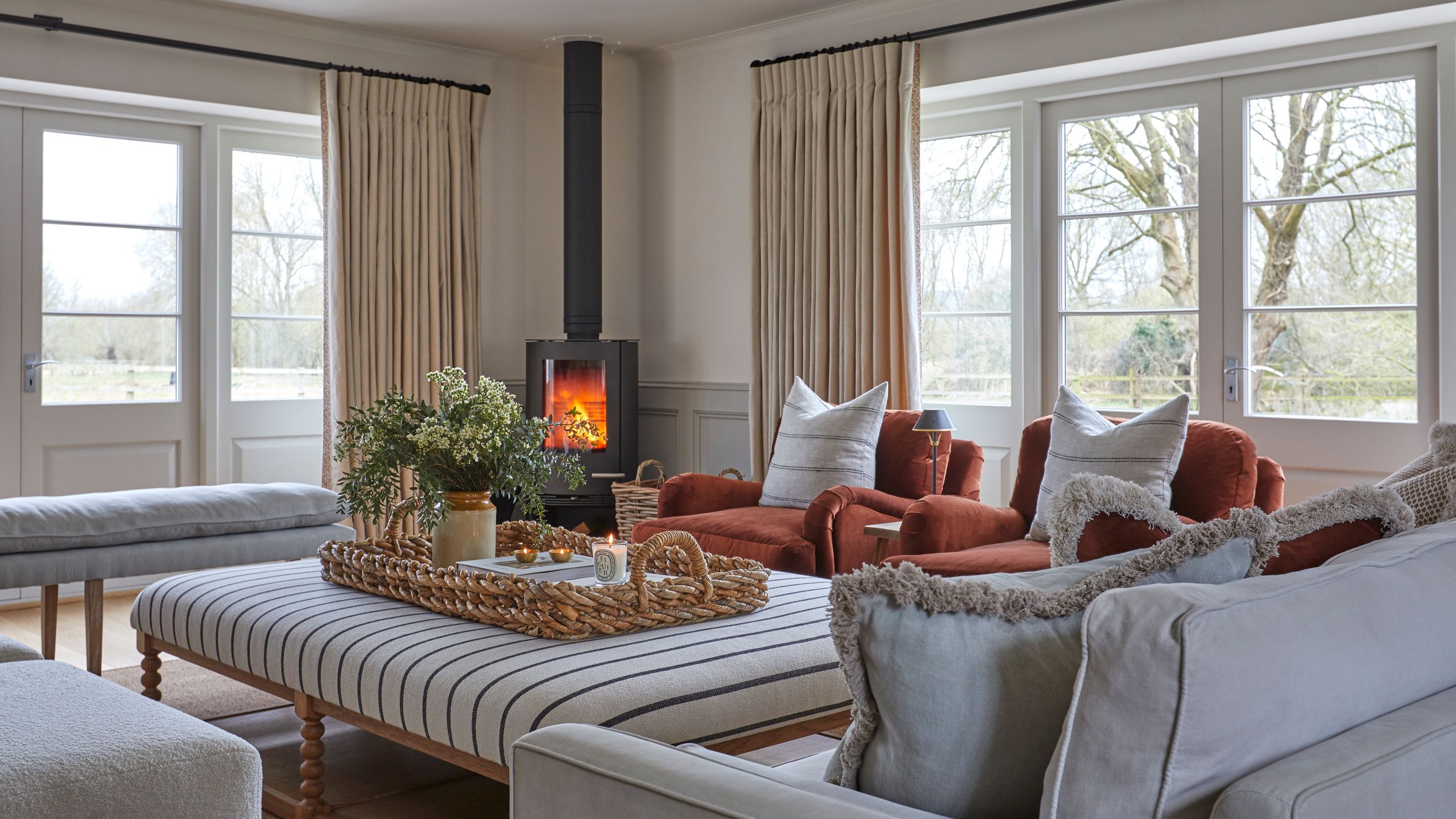 Image may contain: Furniture, Couch, Home Decor, Plant, Cup, Desk, and Table